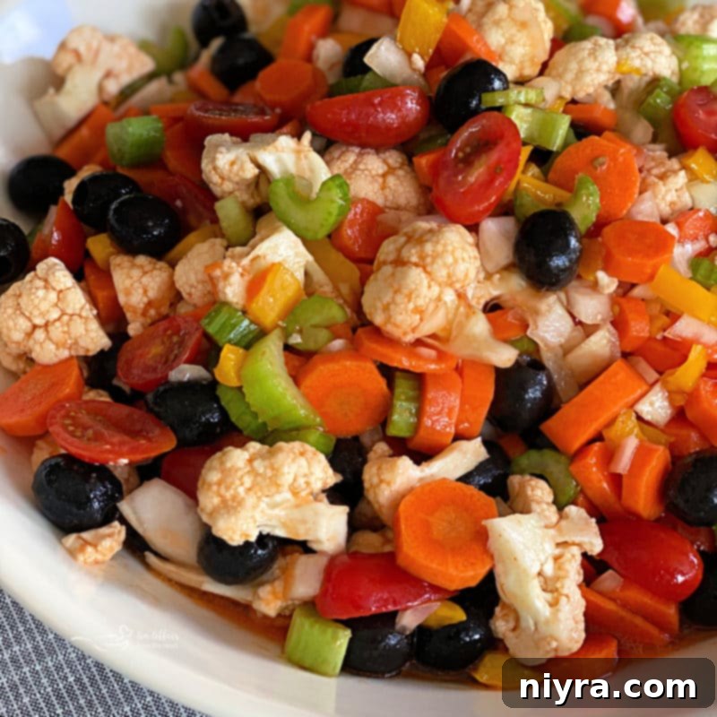 Pegs Fresh Italian Vegetable Salad 13 Mom's Marinated Vegetables in a white bowl, similar to Italian Summer Salad