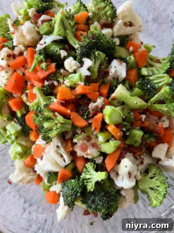 Pegs Fresh Italian Vegetable Salad 8 Mixing chopped vegetables with crumbled bacon for Italian Summer Salad