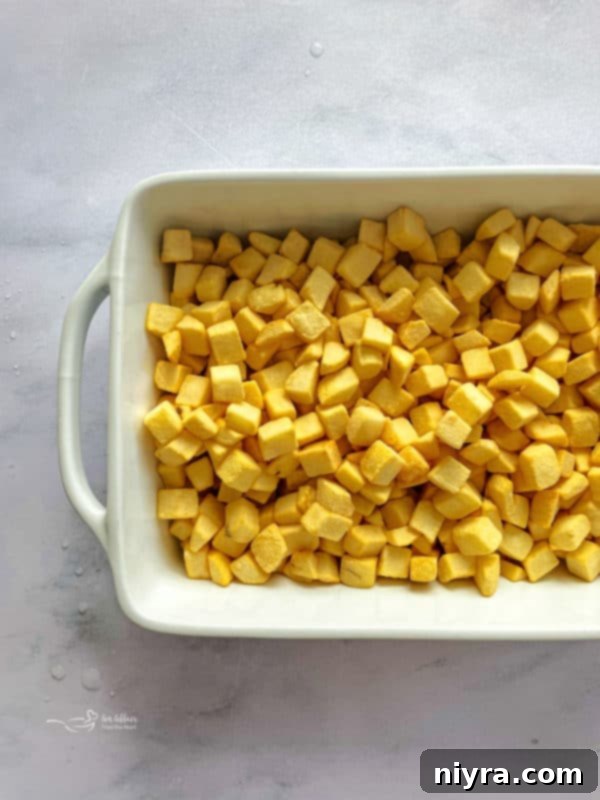 Place thawed hash browns in a large bowl, ready for mixing.