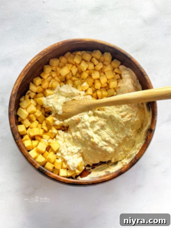 Pour the hash brown mixture into the prepared baking dish.