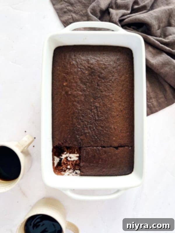 Depression Cake with a generous layer of whipped cream on top