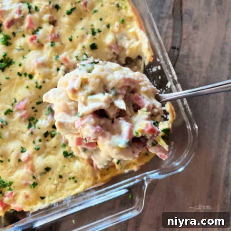 Close-up of baked Chicken Cordon Bleu Casserole with golden edges