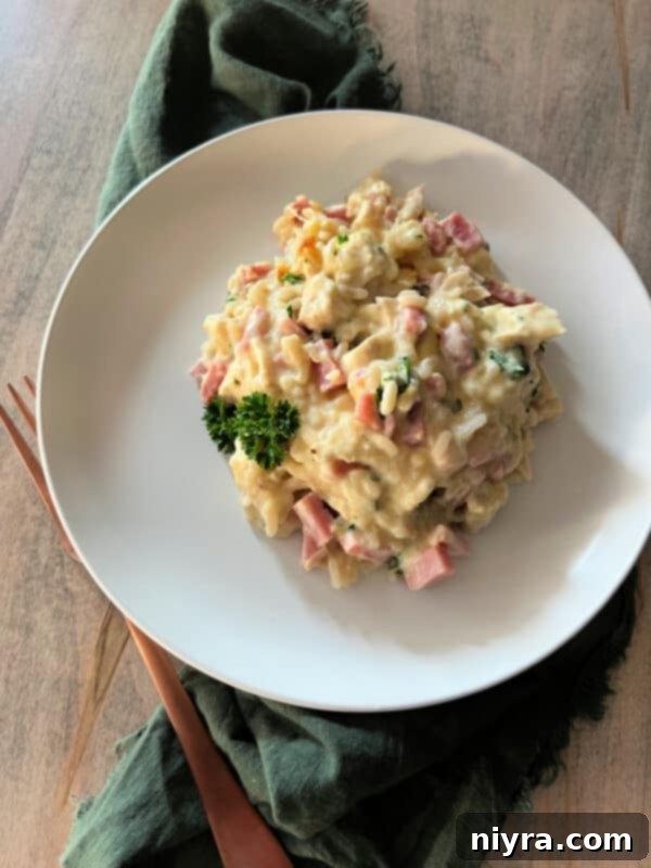 Chicken Cordon Bleu Casserole with Rice in a clear baking dish