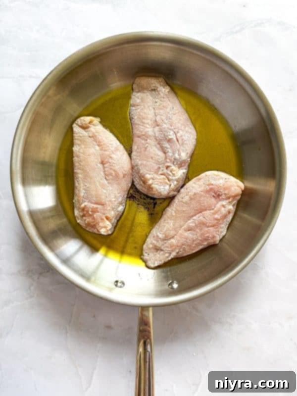 Dredging chicken in flour