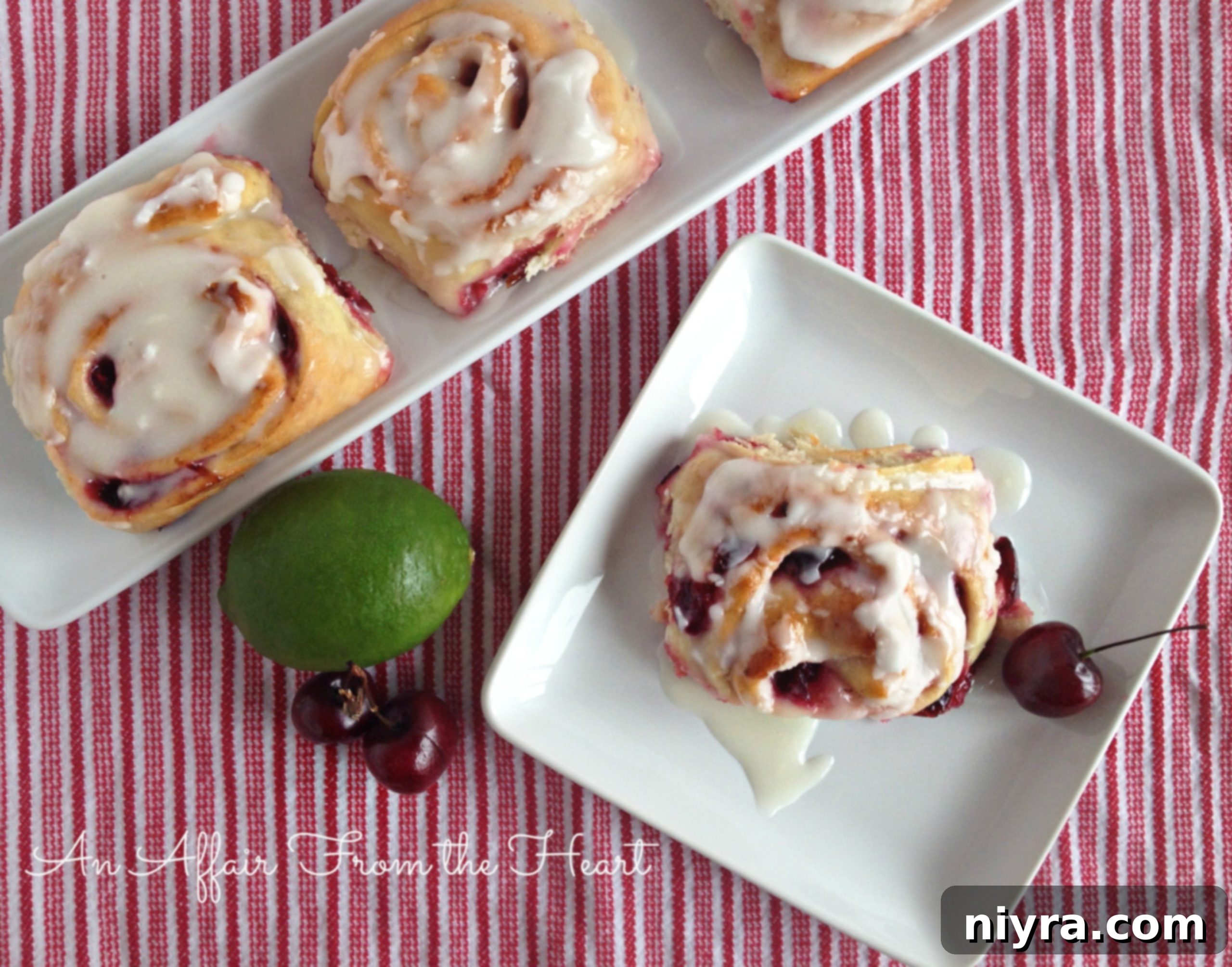 Close up of Cherry Limeade Sweet Rolls with pink frosting