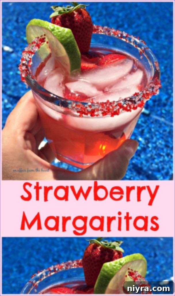 A pitcher of Sauza Strawberry Margaritas being poured into a sugar-rimmed glass, with fresh fruit garnishes.