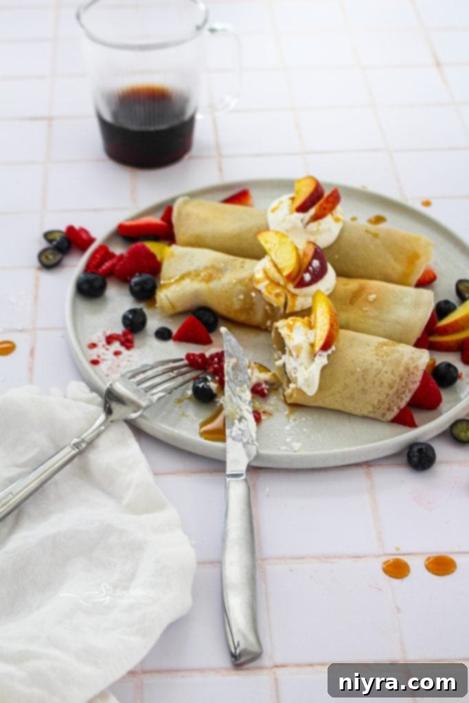A visually appealing Pinterest-friendly image featuring sweet crepes with summer fruit and the text 'Sweet Crepes with Summer Fruit'.