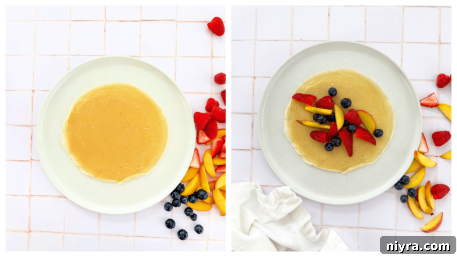 Instructional image showing a cooked crepe being filled with fresh fruit, ready to be rolled or folded.