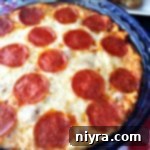 Pizza Dip in a blue dish with text "pizza dip"