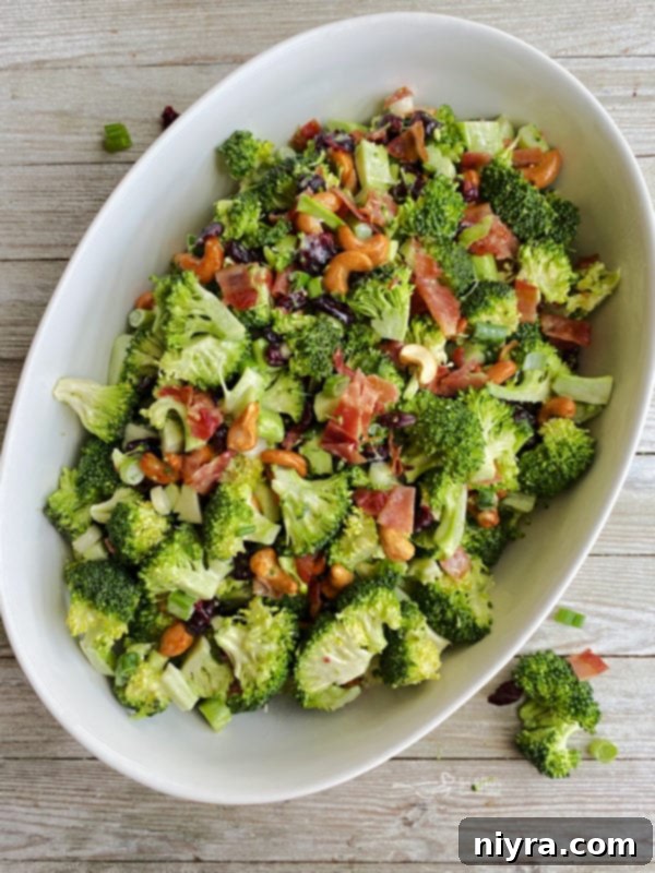 One bowl filled with bacon cashew broccoli salad