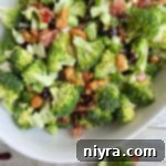 Top view of broccoli in bowl with cashews
