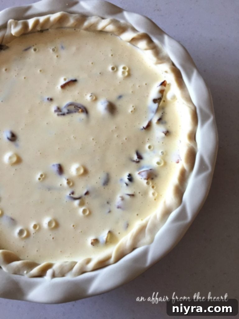 German Onion Tart 8 A Zwiebelkuchen pie, with the onion and bacon filling topped by the creamy egg mixture before baking.