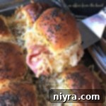 Zesty Horseradish Roast Beef Sliders 11 Close up of a Baked Roast Beef Slider with Horseradish Sauce