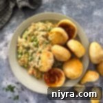 Regal Creamy Chicken Delight 11 Overhead of Chicken à la King and biscuits in a bowl.