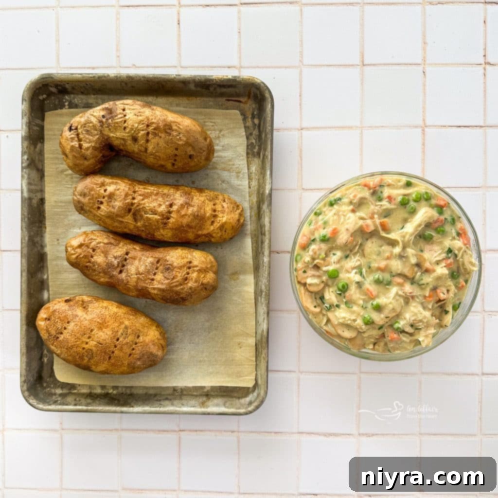 Overhead shot of a Chicken à la King Baked Potato with a fork.