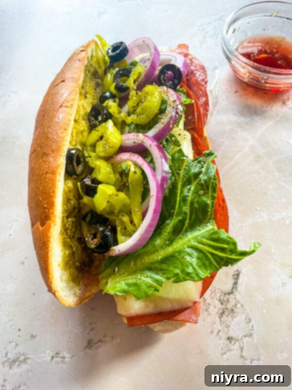 Close-up of a toasted Italian sandwich overflowing with delicious toppings