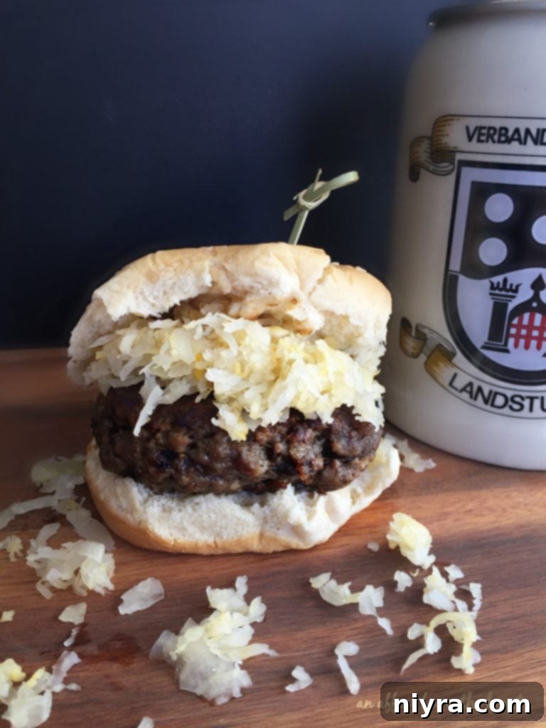 A close-up of a Brat Burger, perfectly grilled and ready to eat