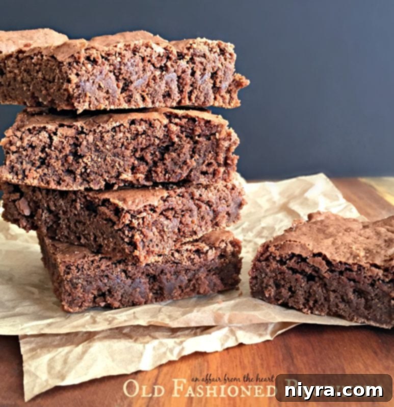 Plate of Old Fashioned Brownies with a dusting of powdered sugar