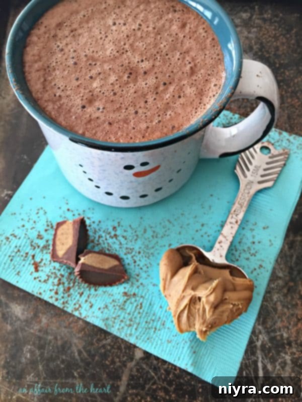 A final, enticing image of Peanut Butter Hot Cocoa in a cozy mug, perfectly frothed