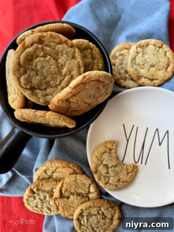Pile of Butter Brickle Cookies on a white plate