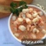 Overhead of Creamy Tomato Seafood Bisque in a white bowl