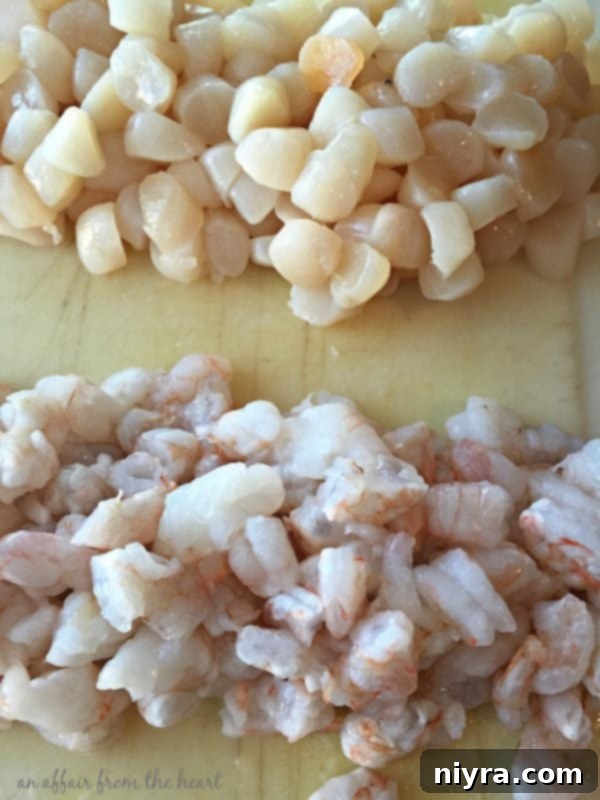 Shrimp and scallops added to the creamy pureed bisque
