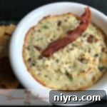 Hot Bacon and Swiss Dip 11 Delicious Hot Bacon & Swiss Dip in a white bowl
