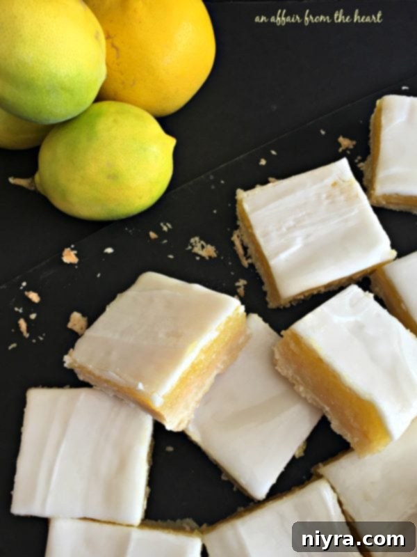 Tangy Lemon Delights 8 Three Glazed Lemon Bars showcasing their distinct layers of crust, filling, and glaze.