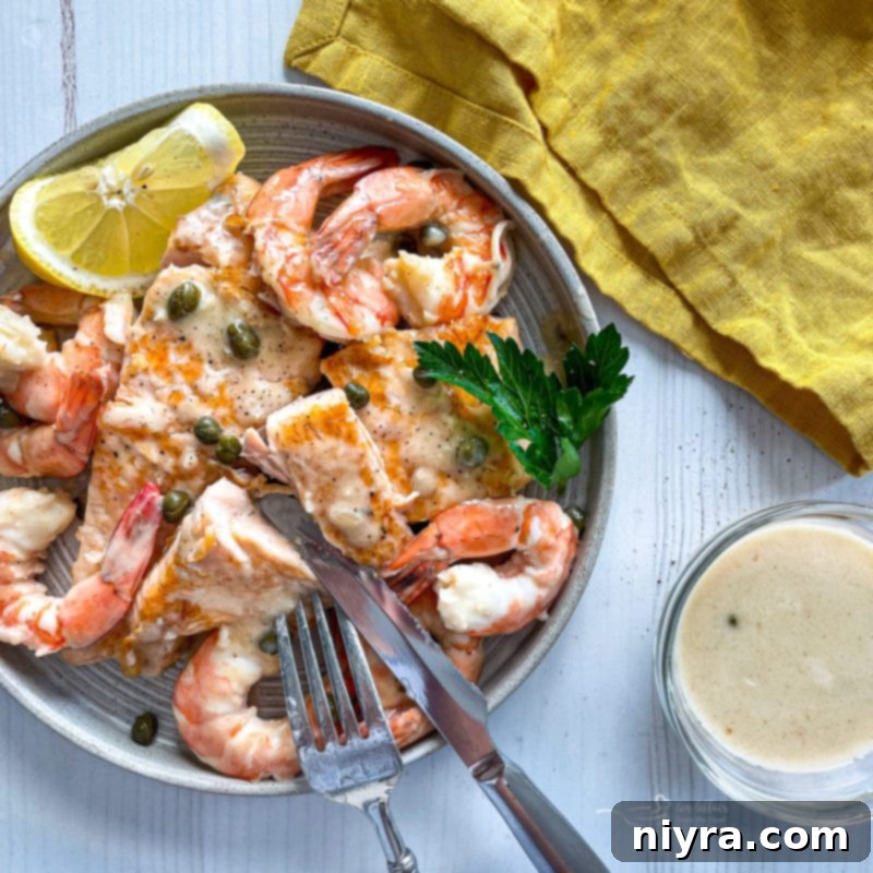 Pan-Seared Salmon and Shrimp in Lemon Caper Sauce 3 One bowl filled with salmon and shrimp