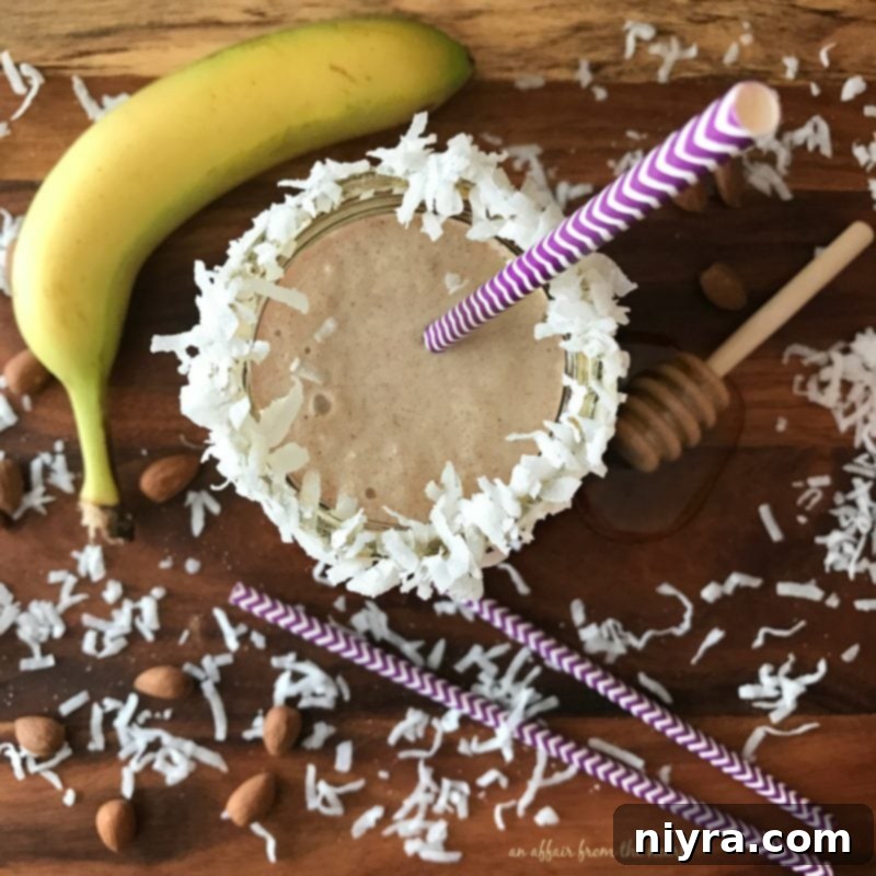 Beautifully prepared Nutty Monkey Smoothie topped with shredded coconut and a hint of cinnamon