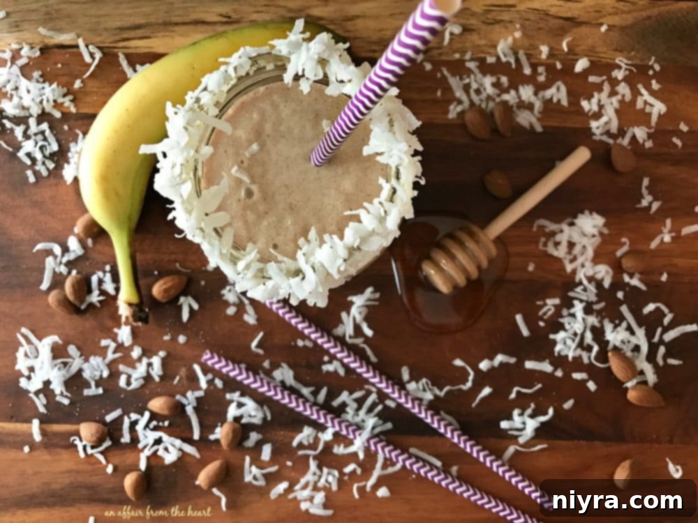 Nutty Monkey Smoothie with a honey-coconut rim, ready for a refreshing sip