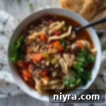 Hamburger Soup With or Without Noodles in a white bowl