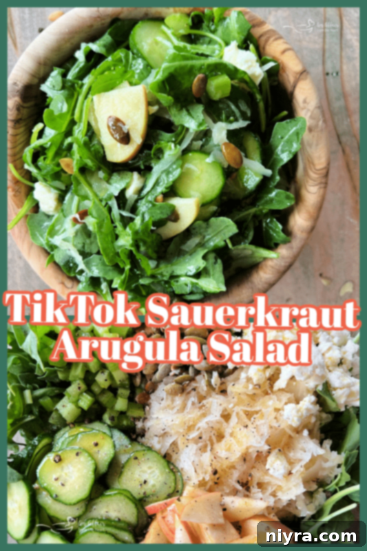 A serving of TikTok Sauerkraut Arugula Salad in a small white bowl.