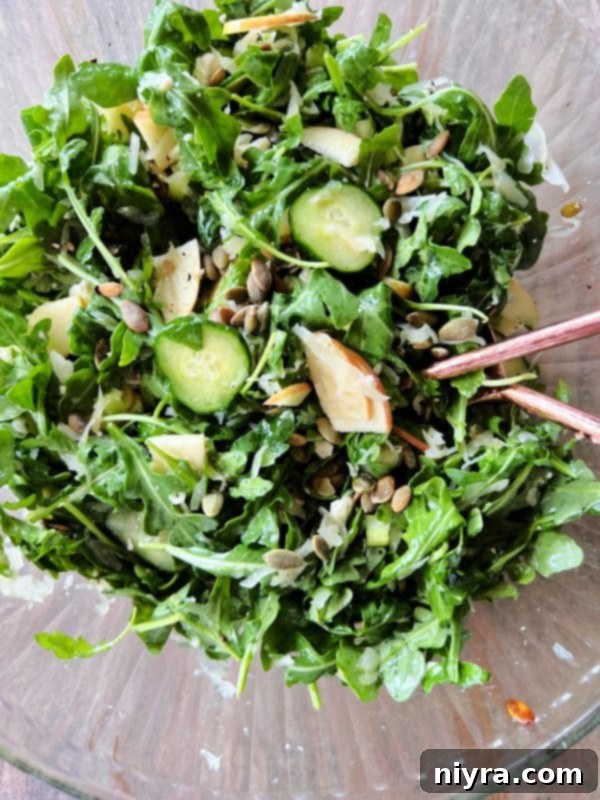 Close-up of the Sauerkraut Arugula Salad in a bowl, showing the crisp textures.