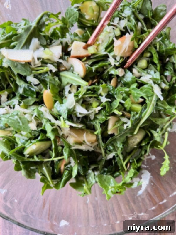Ingredients for TikTok Sauerkraut Arugula Salad laid out on a wooden board.