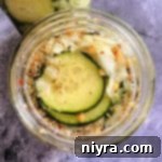 Sweet & Spicy Refrigerator Pickles in a mason jar
