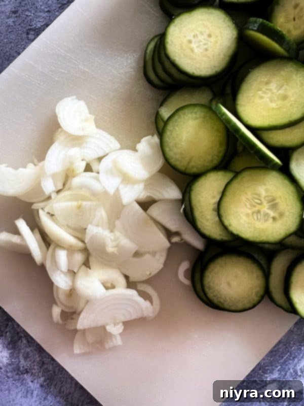 Two jars of sweet and spicy refrigerator pickles, ready to be stored