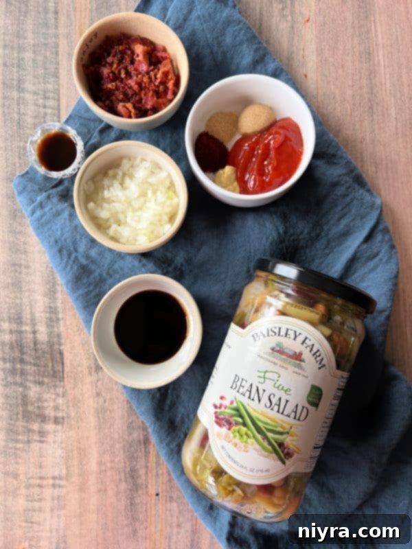 A delicious spoonful of Five Bean Baked Beans being lifted from a casserole dish, ready to be served.