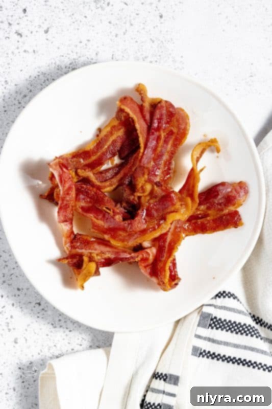 Cooked air fryer bacon in a serving bowl