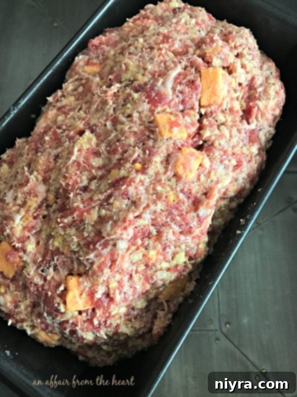 Meatloaf mixture formed into a loaf and placed in a pan
