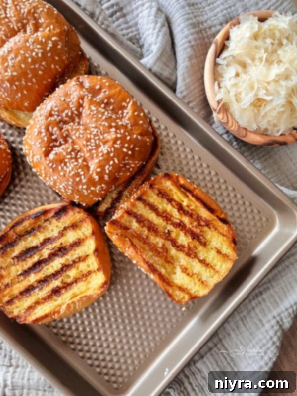 Step-by-step image of buttering burger buns