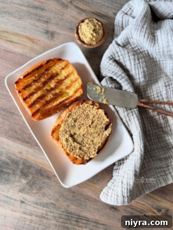 Step-by-step image of slathering bun with mustard