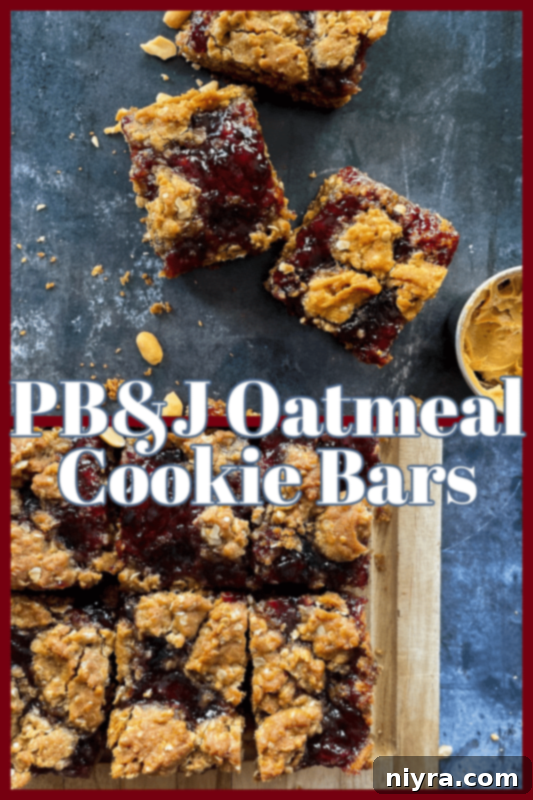 A close-up of a single PB&J Oatmeal Cookie Bar on a wooden surface