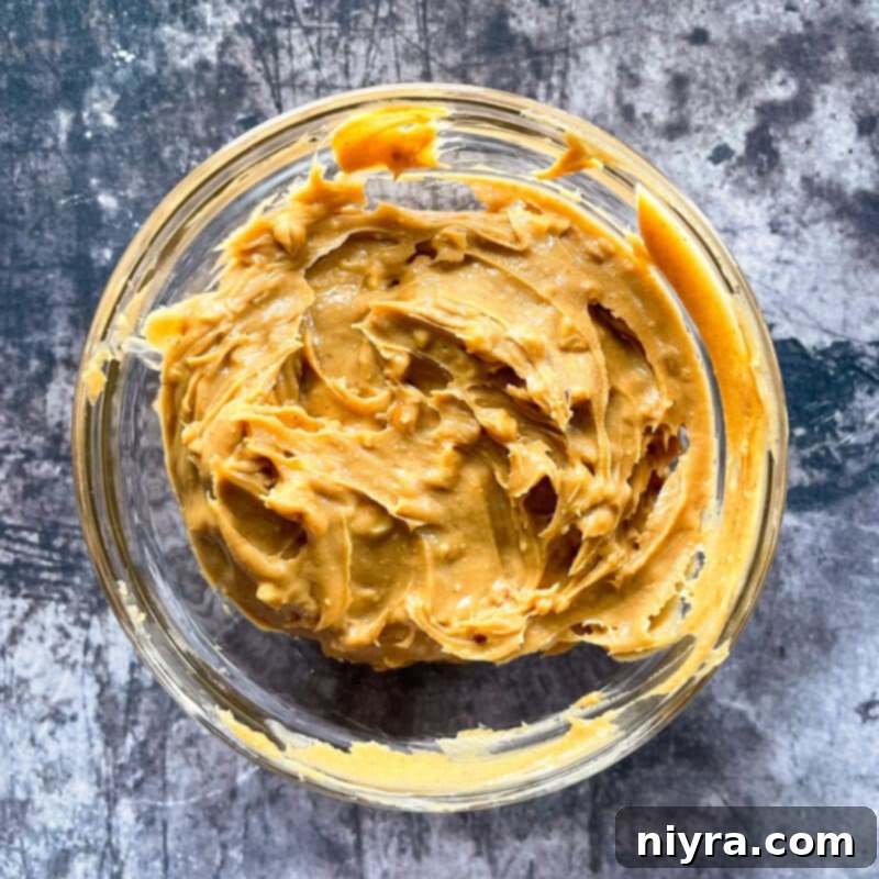 A bowl of grape jelly, ready to be used in the cookie bars