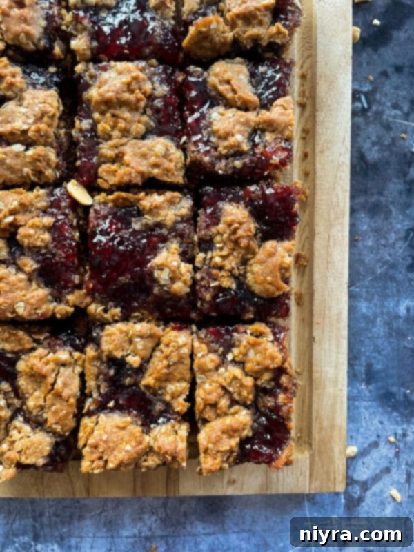 Close-up of a stack of PB&J Oatmeal Cookie Bars