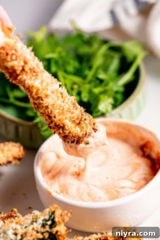 Crispy Air Fryer Zucchini 14 Golden brown and crispy air fryer zucchini fries after cooking