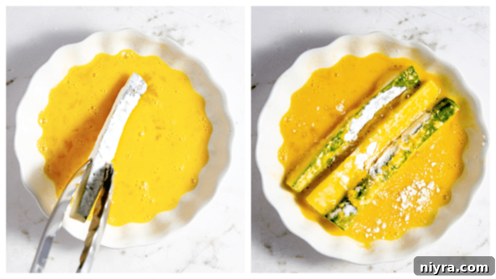 Crispy Air Fryer Zucchini 10 Zucchini fry being dipped in flour