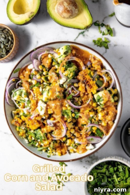 A generously filled bowl of Grilled Corn and Avocado Salad, emphasizing its freshness and appeal