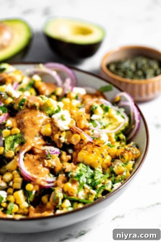 Overhead shot of the Grilled Corn and Avocado Salad in a large, rustic serving bowl, ready to be enjoyed