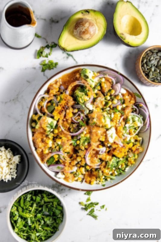 An assortment of fresh herbs, including vibrant green basil and mint leaves, ready for chopping